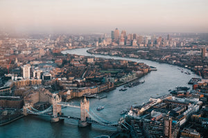 Aerial view of London Bridge and Canary Wharf in London.