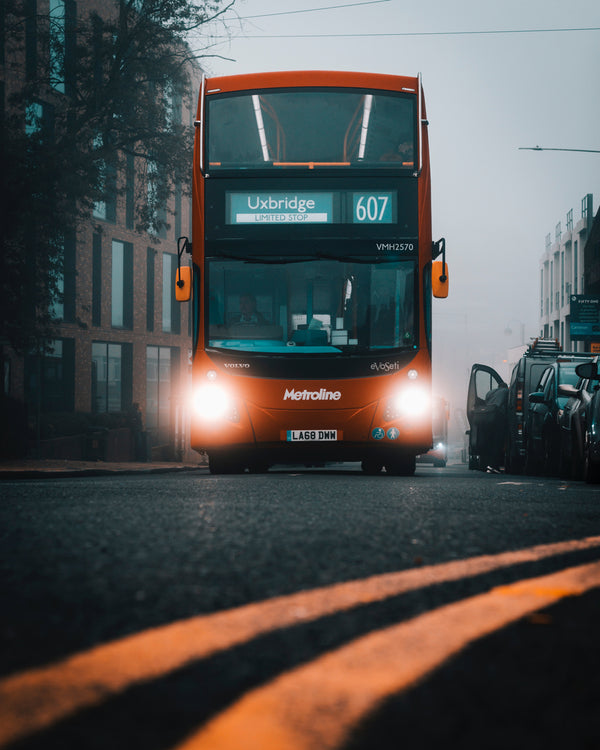 Go to article: A red double decker bus on a foggy day in a street of Uxbridge in Hilingdon in London