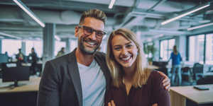 A couple of business people happy after buying second hand furniture for their London office in EC1