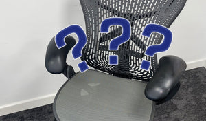 three question marks on the background of a second hand office chair