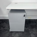 closeup of metal mobile pedestal under a white cantilever office desk