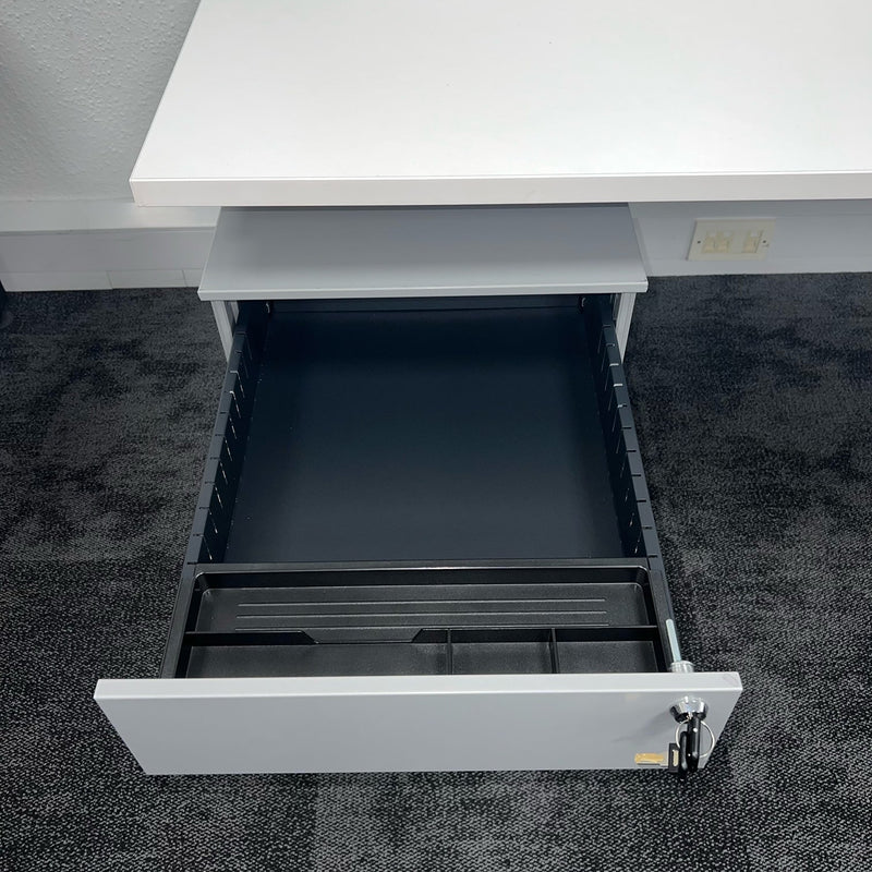open drawer on a grey mobile pedestal