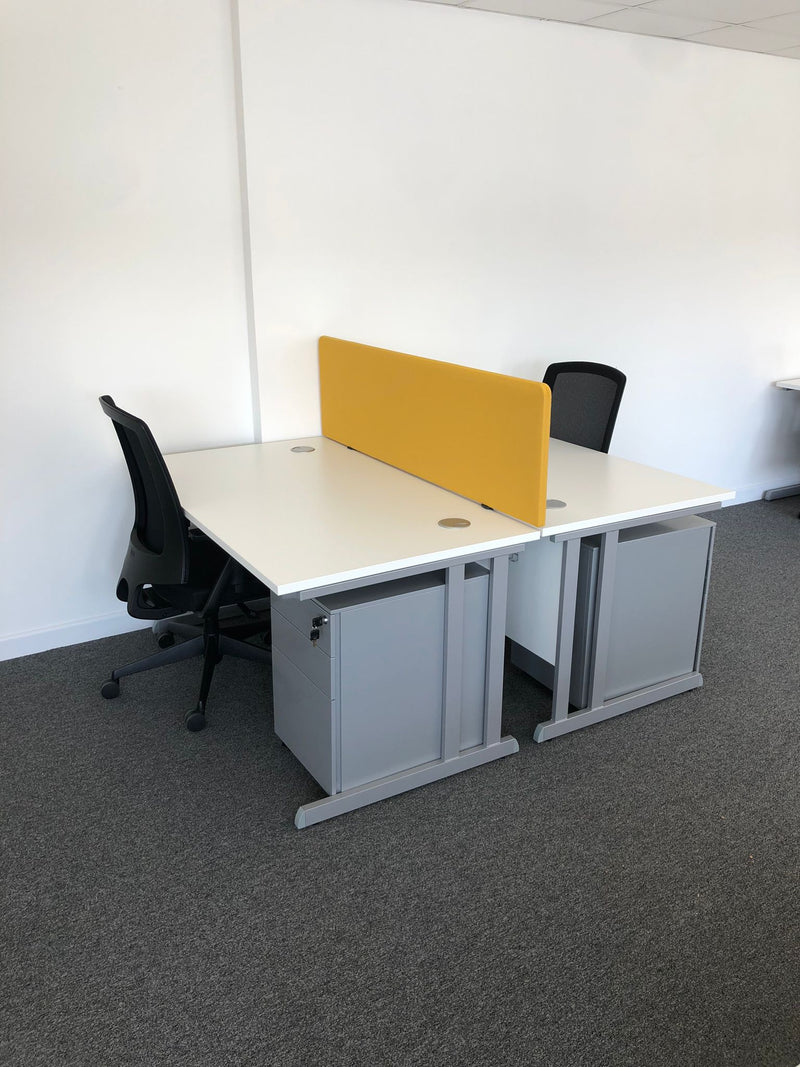 two person bench desk workstation with used office chairs and a yellow desk panel