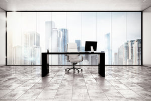 executive office desk and chair with city panorama in the background