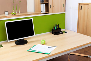 used office desk with green desk screen