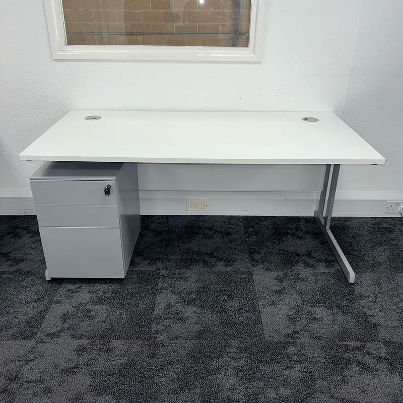 front view of a white cantilver office desk with grey underdesk pedestal