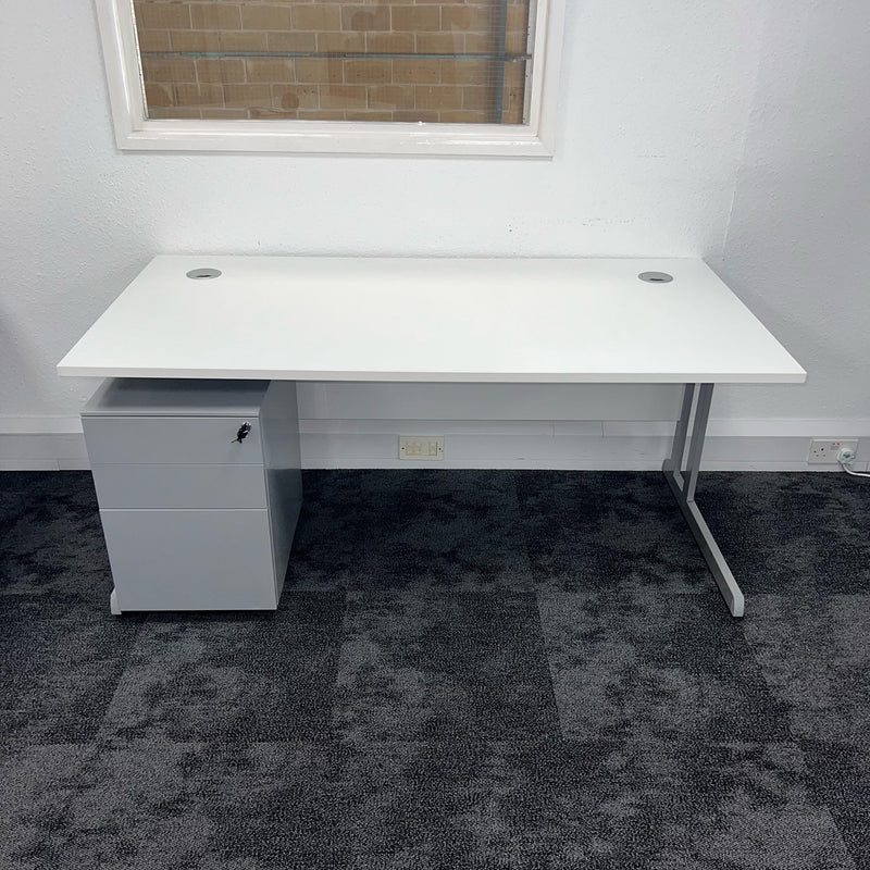 white cantilever office desk with a three drawer pedestal