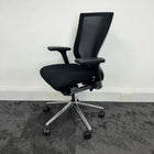 left side view of a black mesh backrest operator chair, used office furniture